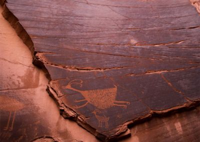 Ancient carvings on rock wall